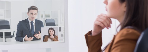 Female boss talking with applicants online on video conference courtesy of Shutterstock.com